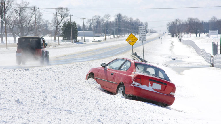 Car loses control after sliding on black ice.