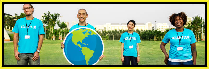 Group of charity trustees holding a globe.