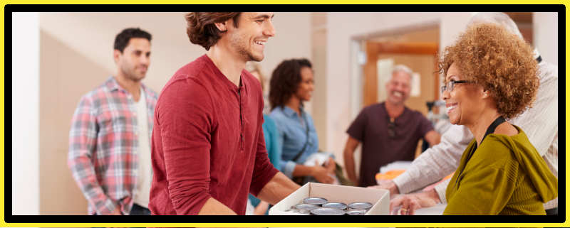 Man making a donation to a food bank or exchange